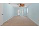 Comfortable bedroom with carpet, ceiling fan and sliding glass doors to the outside at 4531 44Th S St, St Petersburg, FL 33711