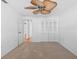 Bedroom features a ceiling fan, closet, and a door leading to the hallway at 4531 44Th S St, St Petersburg, FL 33711