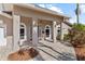 Inviting front entrance with arched windows, neutral color palette, and updated brick pavers at 4531 44Th S St, St Petersburg, FL 33711
