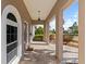 Spacious front porch featuring brick pavers, updated lighting, and neutral paint scheme at 4531 44Th S St, St Petersburg, FL 33711