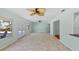 A spacious living room has a view of the pool and tiled floors at 4531 44Th S St, St Petersburg, FL 33711