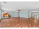 Open-concept living space with laminate flooring and neutral paint, bathed in natural light at 4531 44Th S St, St Petersburg, FL 33711