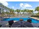 Tranquil pool area overlooking waterway, perfect for entertaining, featuring mature palms at 4531 44Th S St, St Petersburg, FL 33711