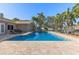 Backyard pool with patio, palm trees, and waterfront view at 4531 44Th S St, St Petersburg, FL 33711