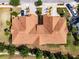 Aerial view of home showing paver driveway, well manicured lawn, and close proximity to neighbors at 4730 Wandering Way, Wesley Chapel, FL 33544