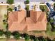 Aerial view of home showing paver driveway, well manicured lawn, and close proximity to neighbors at 4730 Wandering Way, Wesley Chapel, FL 33544