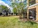 Exterior view of a lush lawn and landscaping surrounding a beautiful home at 4730 Wandering Way, Wesley Chapel, FL 33544