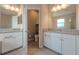 Bathroom boasts dual vanities with granite countertops, separate toilet room, and modern fixtures at 4730 Wandering Way, Wesley Chapel, FL 33544