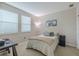 Bright bedroom features two sunny windows, cozy carpet, a comfortable bed and modern desk perfect for work or study at 4730 Wandering Way, Wesley Chapel, FL 33544