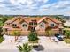 An attractive home featuring multi-car garages, a paver driveway, and carefully designed landscaping at 4730 Wandering Way, Wesley Chapel, FL 33544