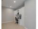 A dedicated home office space features built-in desk and shelving at 4730 Wandering Way, Wesley Chapel, FL 33544