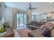 Relax in the living room with seamless outdoor access, a cozy couch, and an open layout at 4730 Wandering Way, Wesley Chapel, FL 33544