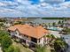 Rear exterior of property with screened in lanai, balcony, and a view of the community pool at 4730 Wandering Way, Wesley Chapel, FL 33544