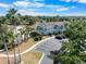 An aerial view of the townhouse complex with its well-maintained landscaping and ample parking at 5084 Misty Canal Pl, Bradenton, FL 34203