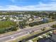 An aerial view of a sprawling community with multiple bodies of water and manicured landscaping at 5084 Misty Canal Pl, Bradenton, FL 34203