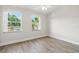 Bright bedroom with two windows and modern flooring at 5084 Misty Canal Pl, Bradenton, FL 34203