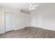 This bedroom features a ceiling fan, new wood flooring and 3 large closets for plenty of storage at 5084 Misty Canal Pl, Bradenton, FL 34203