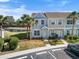Two-story townhome with a manicured lawn at 5084 Misty Canal Pl, Bradenton, FL 34203
