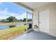 Covered patio with screens offers peaceful water views at 5084 Misty Canal Pl, Bradenton, FL 34203