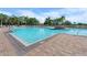 Large community pool with brick pavers and clear blue water at 5084 Misty Canal Pl, Bradenton, FL 34203