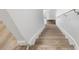 Carpeted staircase with white walls at 5084 Misty Canal Pl, Bradenton, FL 34203