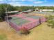 Aerial view of well-maintained community tennis and pickleball courts at 5084 Misty Canal Pl, Bradenton, FL 34203
