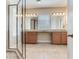 Elegant bathroom showcasing double sinks, granite countertops, and a glass-enclosed shower at 5409 Fishhawk Ridge Dr, Lithia, FL 33547