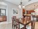 Inviting dining room with a wooden table, decorative art, and adjacent access to the kitchen at 5409 Fishhawk Ridge Dr, Lithia, FL 33547