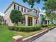 Two-story home with a manicured lawn, complemented by trees and a brick-lined walkway at 5409 Fishhawk Ridge Dr, Lithia, FL 33547