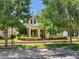 Beautiful two-story home with well-maintained front yard, brick accents, and lush landscaping at 5409 Fishhawk Ridge Dr, Lithia, FL 33547
