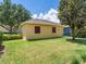 This is a detached two car garage featuring lovely landscaping and a well maintained yard at 5409 Fishhawk Ridge Dr, Lithia, FL 33547