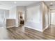 Upstairs hallway featuring a linen closet and neutral colors with plank flooring throughout at 5409 Fishhawk Ridge Dr, Lithia, FL 33547
