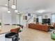 Open concept view of kitchen with island seating, staircase, and large living room at 5409 Fishhawk Ridge Dr, Lithia, FL 33547