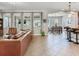 Bright, open living space flowing into the dining area featuring tile flooring and ample natural light at 5409 Fishhawk Ridge Dr, Lithia, FL 33547