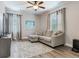 Comfortable living room with a plush gray sofa, patterned rug, and ambient lighting at 5409 Fishhawk Ridge Dr, Lithia, FL 33547