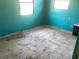 A bedroom with teal walls and two windows at 5700 65Th N Ave, Pinellas Park, FL 33781