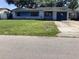 Modest single-story home with a small front yard and attached one-car garage at 5700 65Th N Ave, Pinellas Park, FL 33781