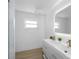 Modern bathroom with double sinks, vanity with drawers and bright LED mirror at 6321 Balboa Ln, Apollo Beach, FL 33572