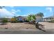Charming coastal home with manicured landscaping, featuring palm trees and a brick-paved driveway at 6321 Balboa Ln, Apollo Beach, FL 33572