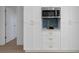 Chic kitchen features white cabinetry, stainless steel microwave, and ample storage at 6321 Balboa Ln, Apollo Beach, FL 33572