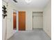 Cozy bedroom includes a closet and an additional door for extra space at 6402 Sawyer Rd, Tampa, FL 33634