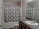 Bathroom featuring a granite countertop, a sink, toilet and shower-tub combination at 6707 Blue Moon Way, Sun City Center, FL 33573