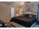 Comfortable main bedroom featuring an ceiling fan, neutral color scheme and carpet flooring at 6707 Blue Moon Way, Sun City Center, FL 33573