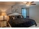 Comfortable main bedroom featuring an ceiling fan, neutral color scheme and carpet flooring at 6707 Blue Moon Way, Sun City Center, FL 33573