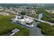 An aerial view shows the property nearby a marina, offering quick access to the water at 6908 11Th E Ave, Palmetto, FL 34221
