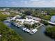 An aerial showcases a marina, featuring a variety of boats and waterfront services in a vibrant coastal setting at 6908 11Th E Ave, Palmetto, FL 34221