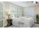 Bedroom with two windows, plush bedding and a white closet at 701 38Th N Ave, St Petersburg, FL 33704