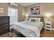 Inviting bedroom with a comfortable bed, a cow themed art, side tables, and soft natural light at 701 38Th N Ave, St Petersburg, FL 33704