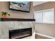 Modern fireplace with a marble surround and sleek electric insert, creating a cozy focal point at 701 38Th N Ave, St Petersburg, FL 33704