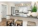 Spacious kitchen with breakfast bar seating and stainless steel refrigerator at 701 38Th N Ave, St Petersburg, FL 33704